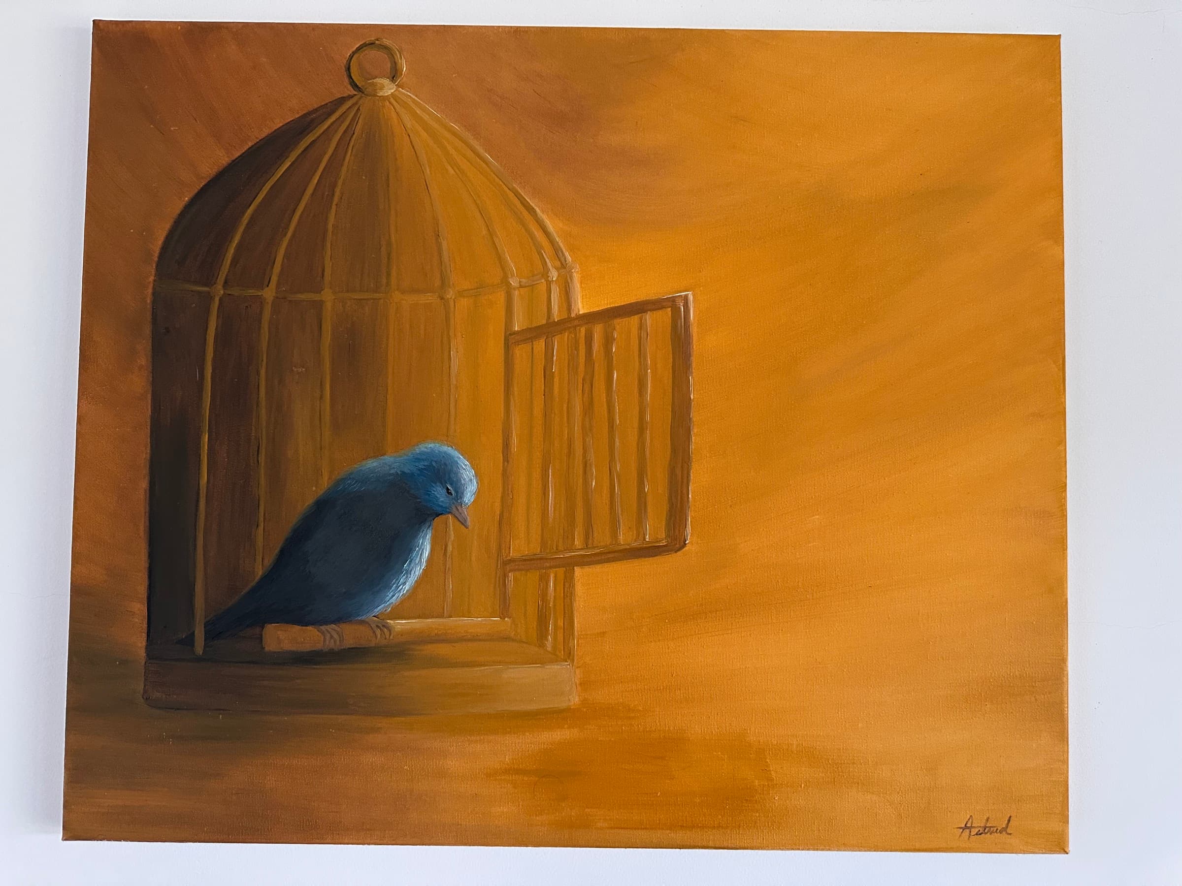Painting of a blue bird perched inside a golden cage with its door open, on a warm ochre background